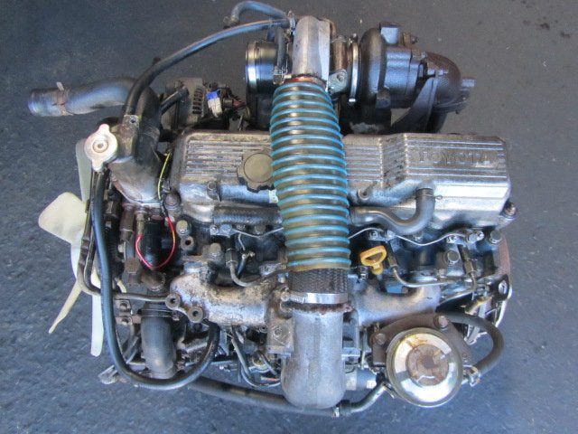 "TOYOTA 14B 3.7 Turbo Diesel engine showing robust cast iron block, turbocharger, and durable components."