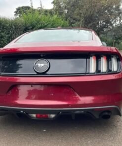 "Used 2018 Ford Mustang sports car parked with sleek styling, alloy wheels, and Mustang badge."